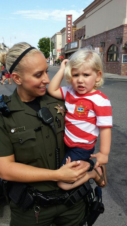 Rachael Dove holds a friend's child when both came to visit her in downtown San Juan Capistrano. Photo courtesy of Rachael Dove
