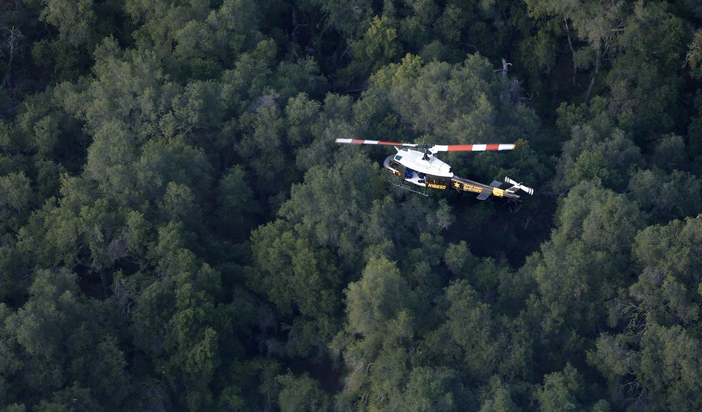 The Orange County Sheriff's Search and Rescue helicopter flies over the Cleveland National Forest on a recent training mission. Photo by Christine Cotter/Behind the Badge OC 