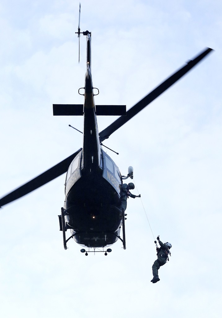 The crew of Orange County Sheriff's Search and Rescue helicopter, Duke, 6 train on hoisting operations in Chiquita Springs.  Photo by Christine Cotter/Behind the Badge OC 