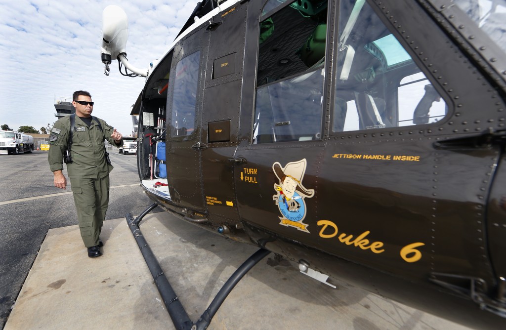 Sgt. Bill Fitzgerald, operations sergeant and pilot for the Orange County Sheriff's Department gets ready for a training exercise with the Orange County Sheriff's Search and Rescue helicopter crew. Photo by Christine Cotter/Behind the Badge OC 