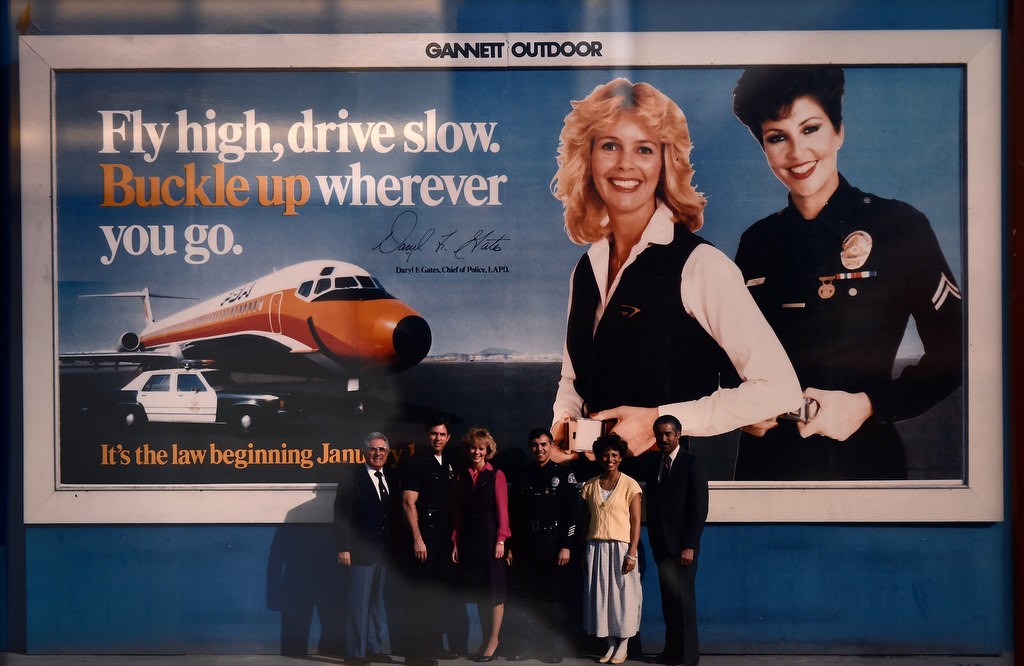 Then-Officer Adrienne Doyle of the LAPD was featured in a billboard campaign about the state's new car seatbelt law, along with this flight attendant, in 1986. Photo courtesy of Adrienne Brandes