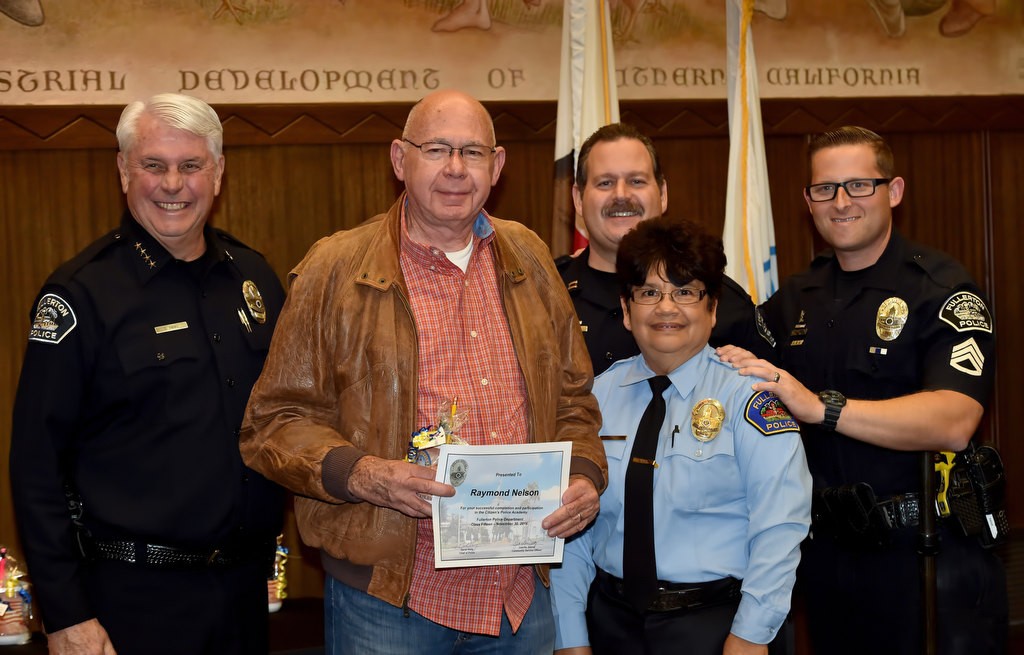 Raymond Nelson receives his Citizen’s Police Academy certificate. With him are Fullerton Police Chief David Hinig, left, Capt. Scott Rudisil, CSO Juanita Juarez and Sgt. Jon Radus. Photo by Steven Georges/Behind the Badge OC