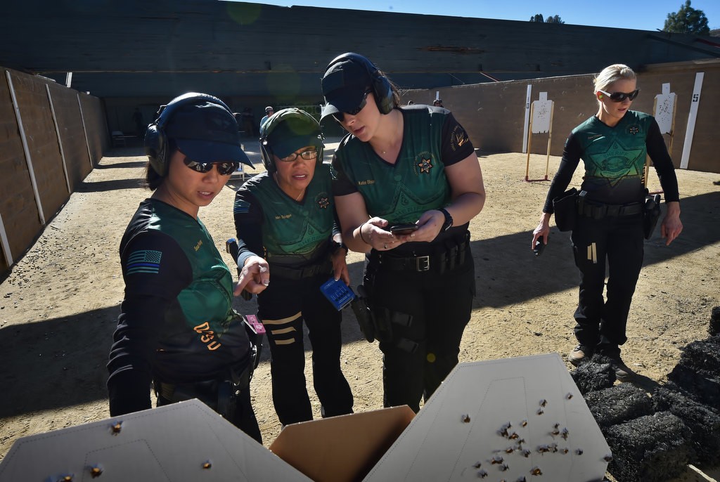 OC Sheriff Dep. Carla Dane fires off a few rounds at the Prado Olympic Shooting Park in Chino as part of the OC Sheriff’s Department Ladies Trigger Team. Photo by Steven Georges/Behind the Badge OC