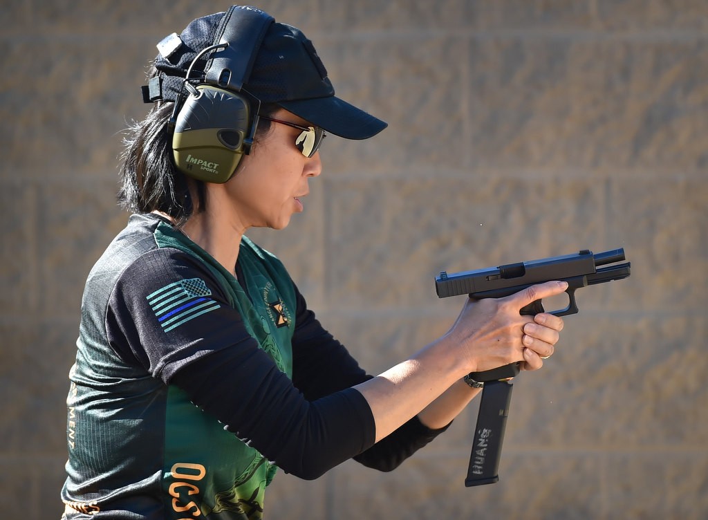 OC Sheriff Dep. Susan Huang changes magazines during a timed competition at the Prado Olympic Shooting Park in Chino. Photo by Steven Georges/Behind the Badge OC