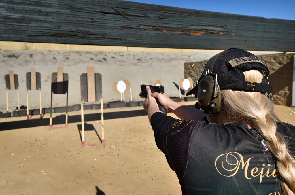 Dep. Norelly MejiaZea of the OC Sheriff’s Department Ladies Trigger Team takes aim at her targets during competition at the Prado Olympic Shooting Park in Chino. Photo by Steven Georges/Behind the Badge OC
