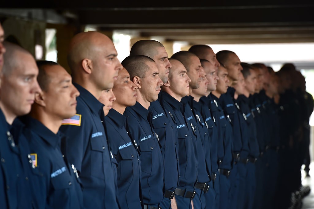 Firefighter recruits stand at attention before family members pass by entering the church for the memorial service for Santa Ana/OCFA Firefighter Ron Castro. Photo by Steven Georges/Behind the Badge OC