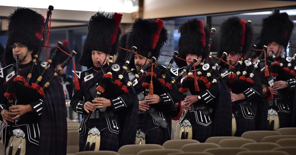 Members of the OCFA Pipes and Drums enter the church during the memorial service for Santa Ana/OCFA Firefighter Ron Castro. Photo by Steven Georges/Behind the Badge OC