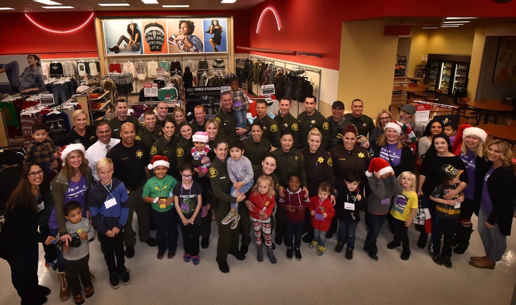 Deputies with the OC Sheriff Department gather with special needs children from aMAYZing Kids at the Target store in Foothill Ranch for the Shop with a Deputy event. Photo by Steven Georges/Behind the Badge OC