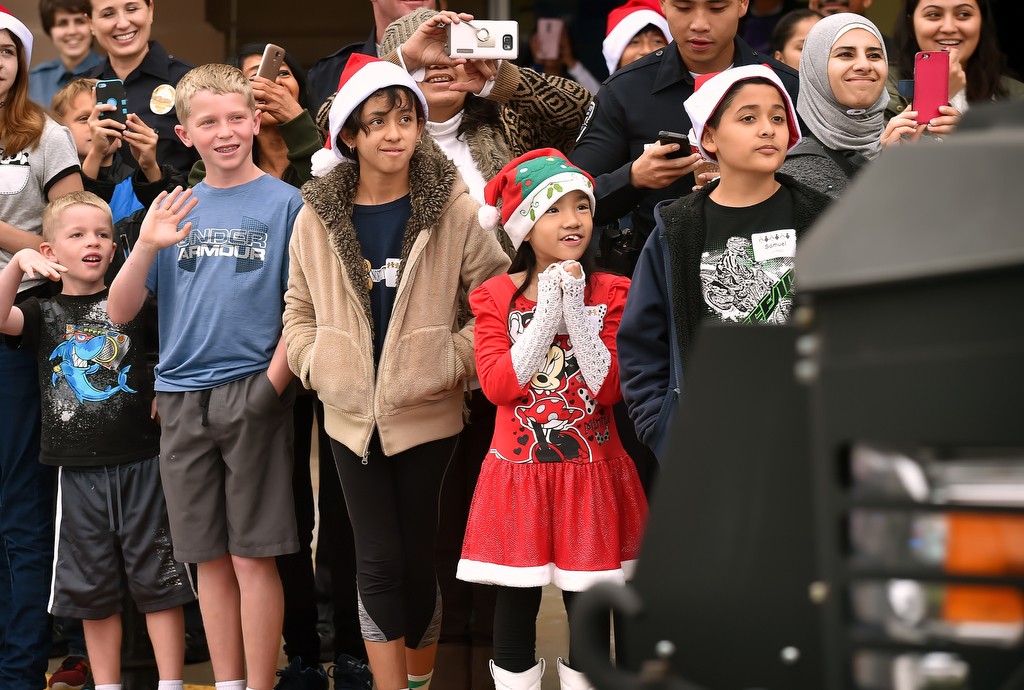 Kids line up as Santa arrives for the Westminster’s annual Shop with a Cop in a Westminster PD BearCat SWAT vehicle. Photo by Steven Georges/Behind the Badge OC