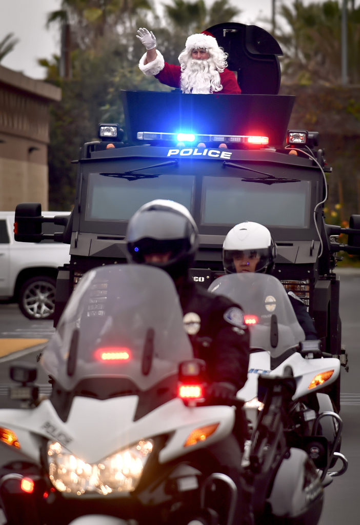 Santa is escorted by Westminster PD as he arrives on top of a Westminster PD BearCat SWAT vehicle for the annual Shop with a Cop event. Photo by Steven Georges/Behind the Badge OC