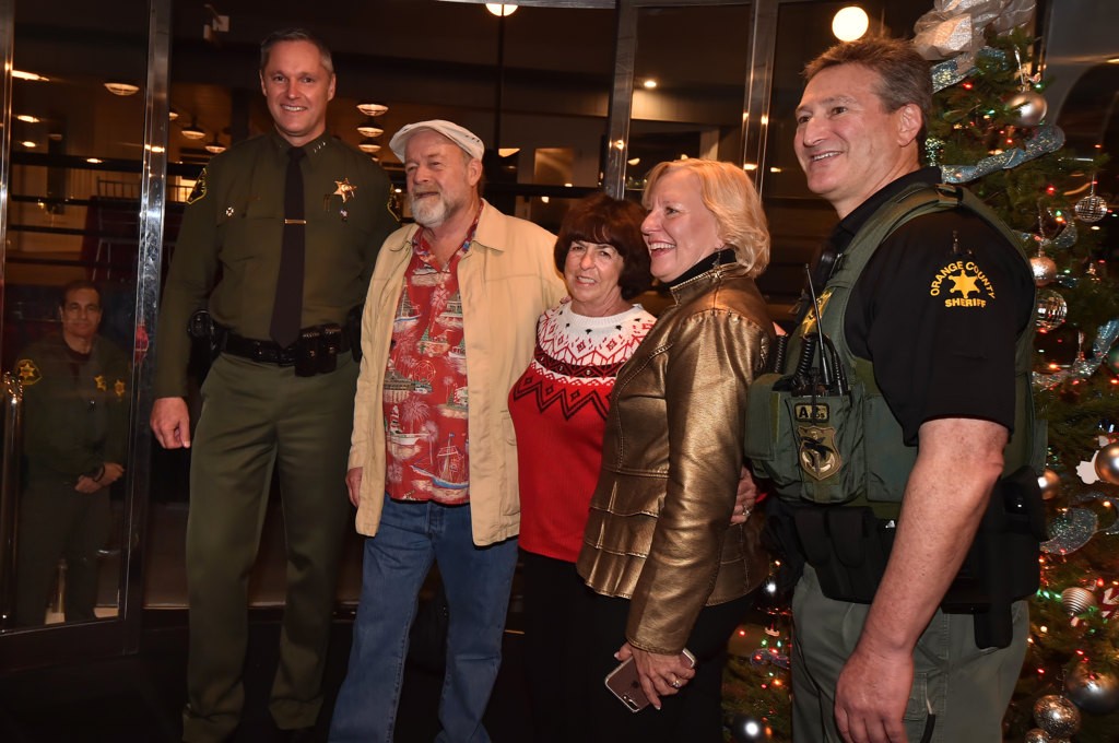 Orange County Undersheriff Don Barnes, left, with Electra Cruises owners Randy Goodman & Lynda Guinther, President/CEO of Make A Wish Orange County/Inland Empire Stephanie McCormick and OC Sheriff Deputy Jay Wasserman, on board the Eternity for the Make A Wish Holiday Harbor Cruise. Photo by Steven Georges/Behind the Badge OC