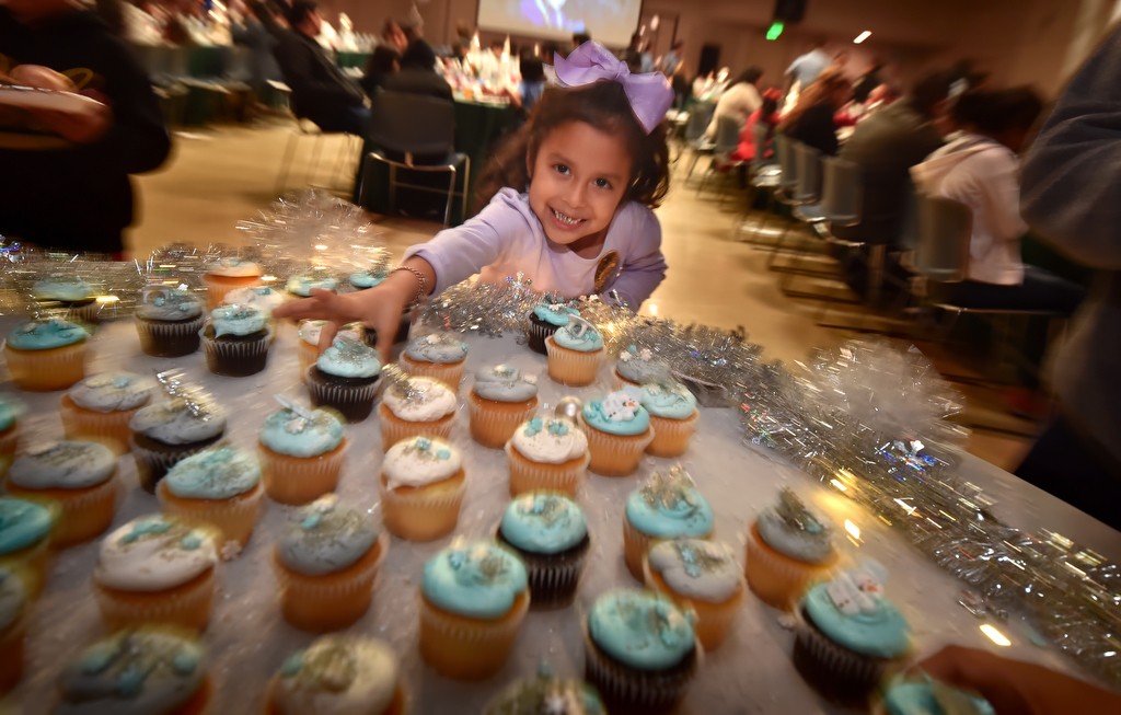 A table full of cupcakes sit ready for the grabbing during Tustin PD’s annual Santa Cop gathering. Photo by Steven Georges/Behind the Badge OC