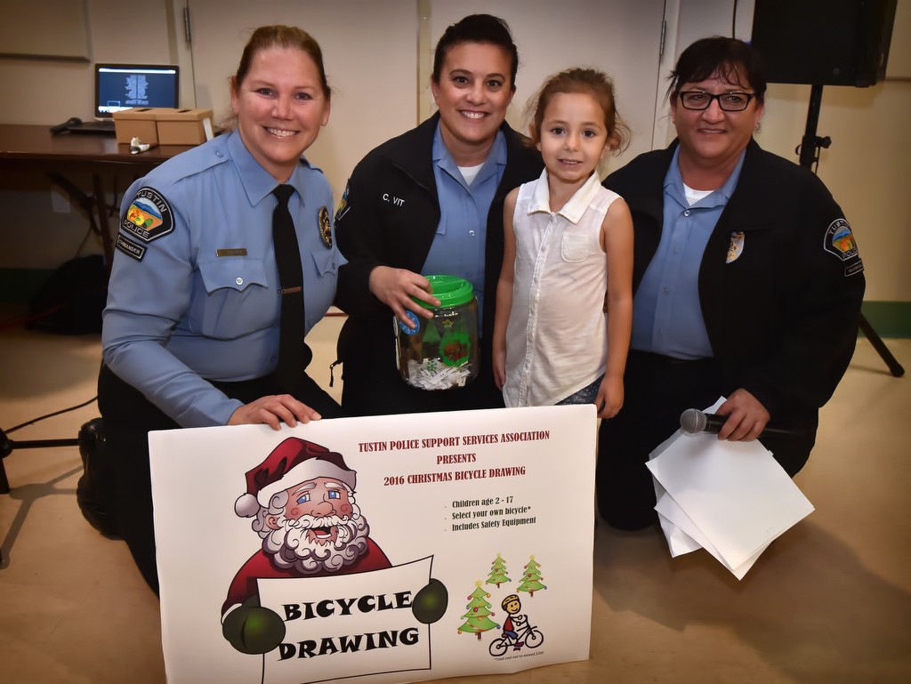 Rachael Olmos, 4, winner of a new bicycle from the Tustin Police Support Services Association. Photo by Steven Georges/Behind the Badge OC