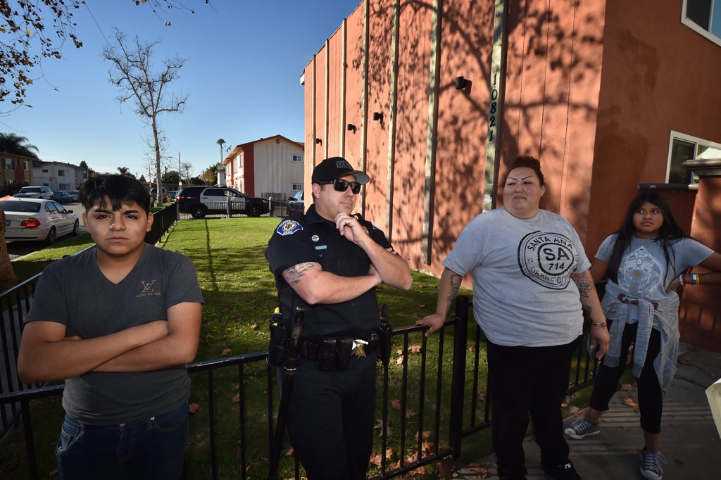 Garden Grove Officer Steve Estlow talks with local residents of the Palma Vista neighborhood. Photo by Steven Georges/Behind the Badge OC