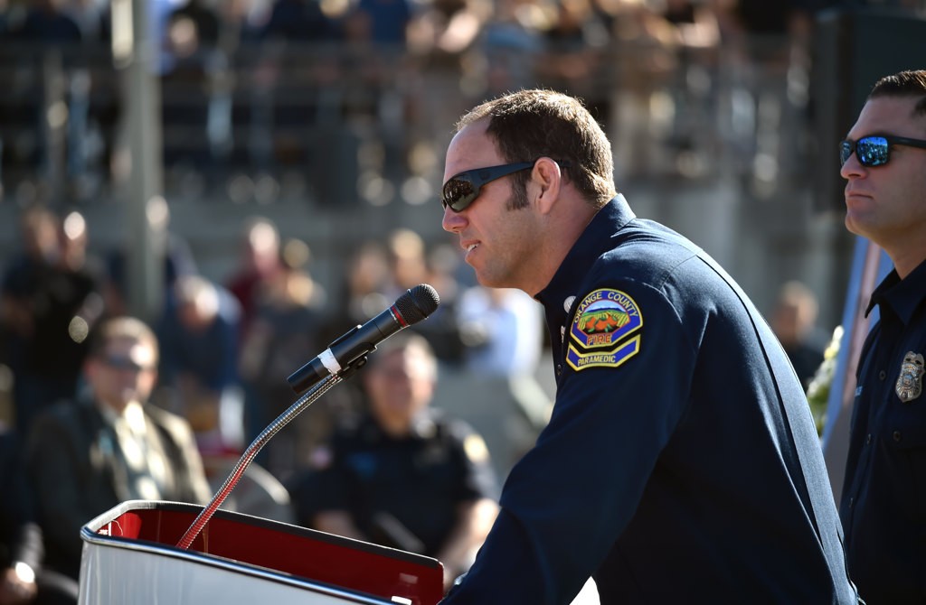 OCFA Capt. Matthew Schuetz talks about his friend and colleague, Capt. Eric Weuve, during a memorial service. Photo by Steven Georges/Behind the Badge OC