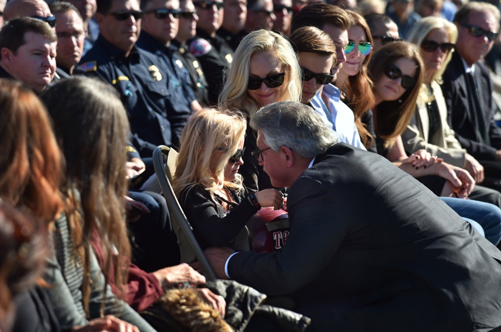 Ken Gabrielson talks about OCFA Capt. Eric Weuve during a memorial service at the base of the Huntington Beach Pier. Photo by Steven Georges/Behind the Badge OC