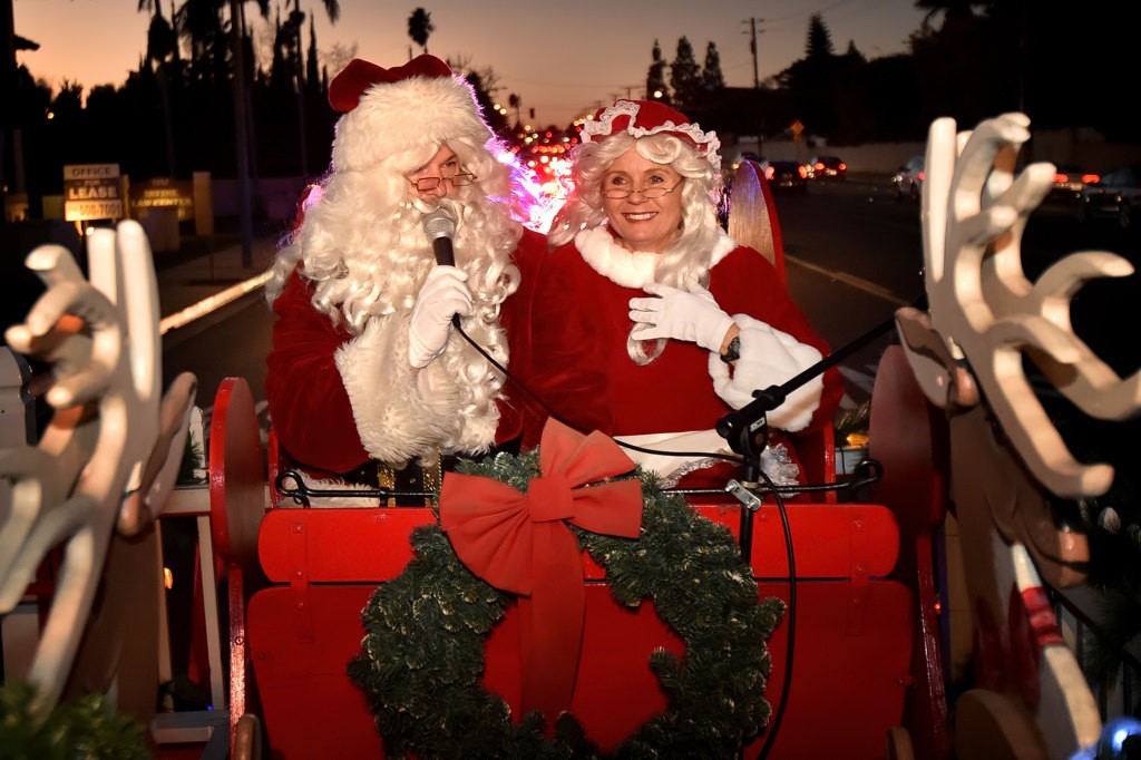 Mr and Mrs Santa on their sleigh, escorted through the streets and neighborhoods of Tustin by the Tustin PD. Photo by Steven Georges/Behind the Badge OC