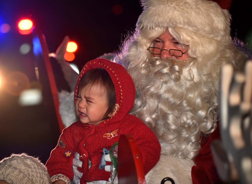 Some kids took a little longer to get use to Santa. Photo by Steven Georges/Behind the Badge OC