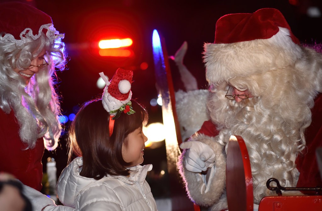 Each kid gets their chance to tell Santa what they want form Christmas. Photo by Steven Georges/Behind the Badge OC