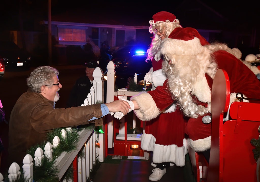 The Tustin PD escorts Mr and Mrs Santa through the streets and neighborhoods of Tustin.