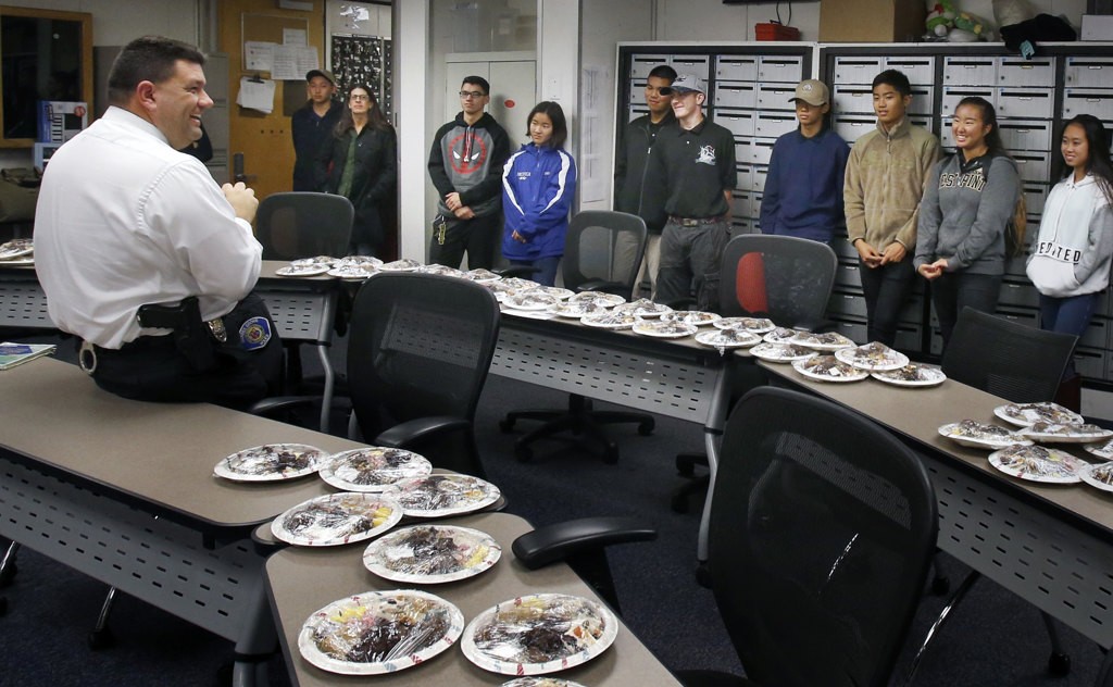 Sgt. Bill Allison addresses a group of JROTC members who helped deliver hundreds of sweet treats to the Garden Grove Police Department. Photo by Christine Cotter/Behind the Badge OC