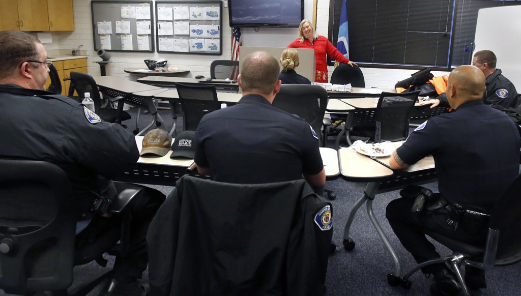 Garden Grove resident Karen Hatfield thanks Garden Grove police officers for their service. She showed her appreciation by delivering hundreds of home made sweets the the police department.  Photo by Christine Cotter/Behind the Badge OC