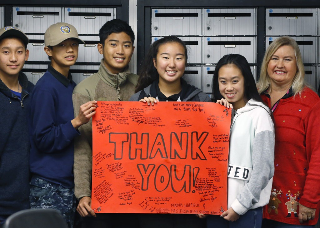 Karen Hatfield, right, with JROTC members who showed their appreciation to the Garden Grove police department. Photo by Christine Cotter/Behind the Badge OC