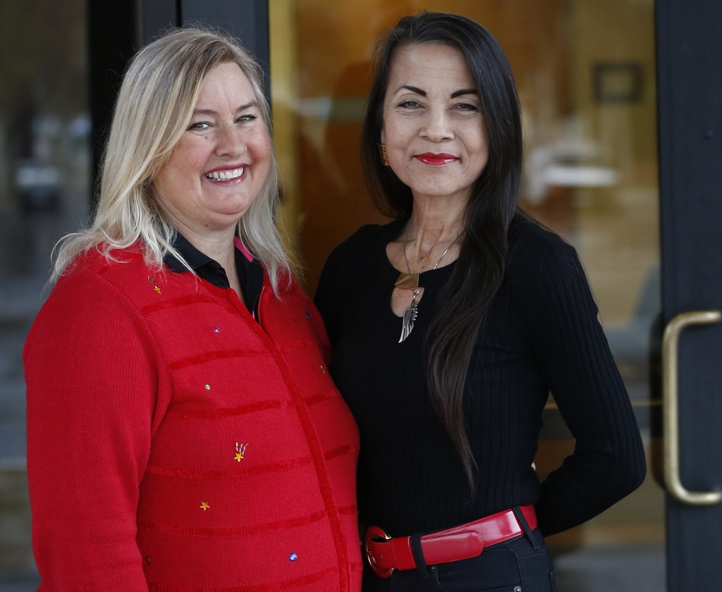 Garden Grove Community Liaison, Cindy Nagamatsu Hanlon, right, helped arrange a visit by Karen Hatfield, left, to the Garden Grove Police Department. Karen delivered homemade desserts to the department.   Photo by Christine Cotter/Behind the Badge OC