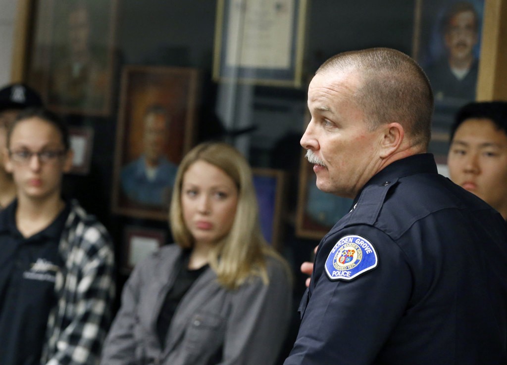 JROTC members listen intently to Garden Grove Police Chief Todd Elgin during a visit to the police station.  Photo by Christine Cotter/Behind the Badge OC