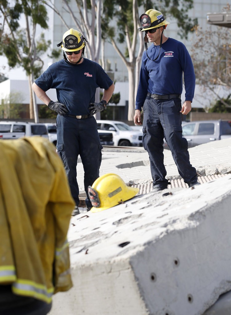 Escondido firefighter/paramedic Jeremy Frasca, right and a Cal Fire firefighter take part in a a training exercise at Anaheim Fire & RescueÕs North Net Training Center. Photo by Christine Cotter