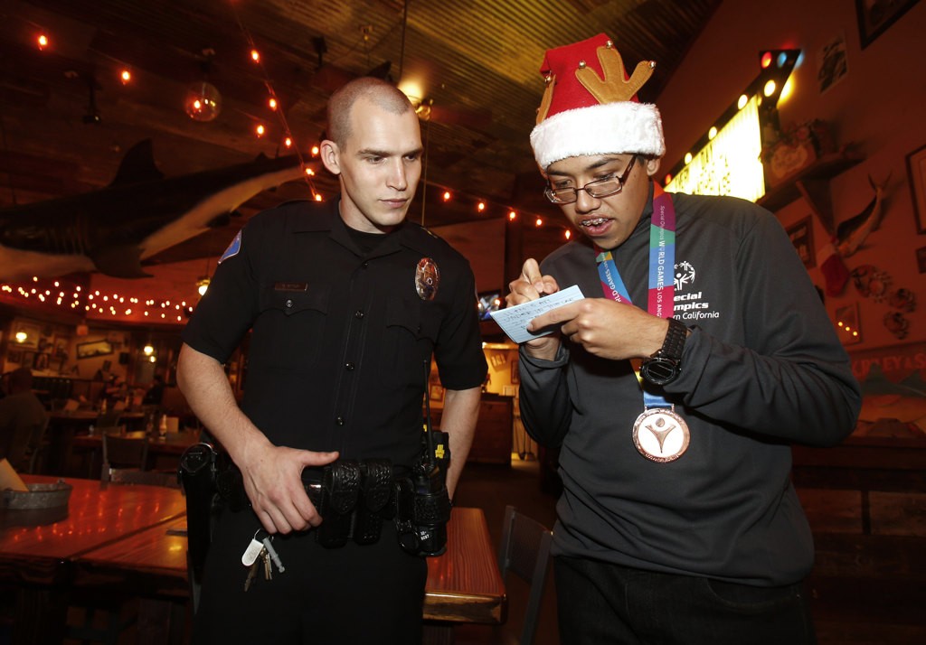 Garden Grove Officer Michael Gerdin and Special Olympics athlete Mark Wolffer at Joe's Crab Shack fundraiser for Special Olympics. Photo by Christine Cotter