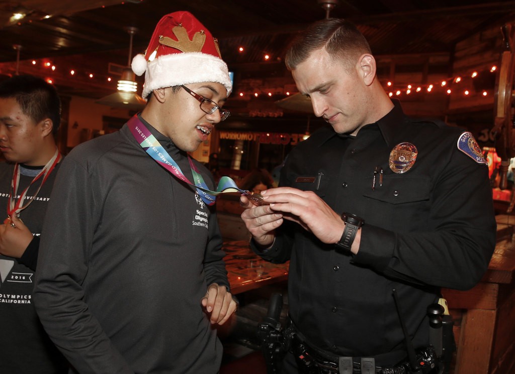 Garden Grove Officer Jeremy Morse and Special Olympics athlete Mark Wolffer at a Joe's Crab Shack fundraiser for Special Olympics. Photo by Christine Cotter