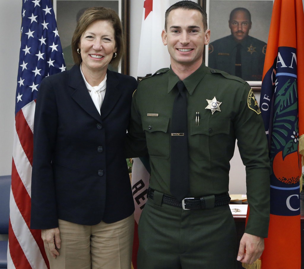 OC Sheriff Sandra Hutchens with new Lateral Jared Hendee. Photo by Christine Cotter