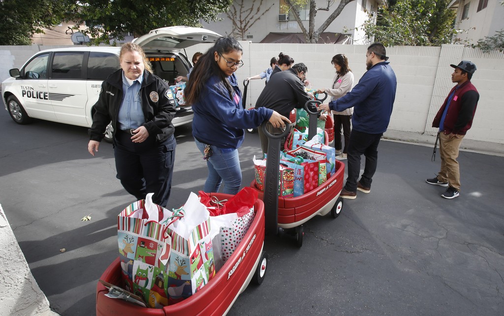 Christmas gifts are ready to be delivered to children hospitalized with brain injuries.  Photo by Christine Cotter/Behind the Badge OC