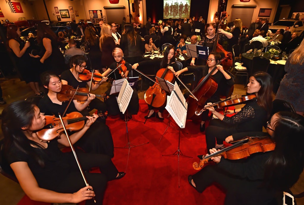 The Beckman Chamber Orchestra plays Somewhere Over the Rainbow at the start of Tustin Police Department Awards Banquet at the Marconi Automotive Museum. Photo by Steven Georges/Behind the Badge OC