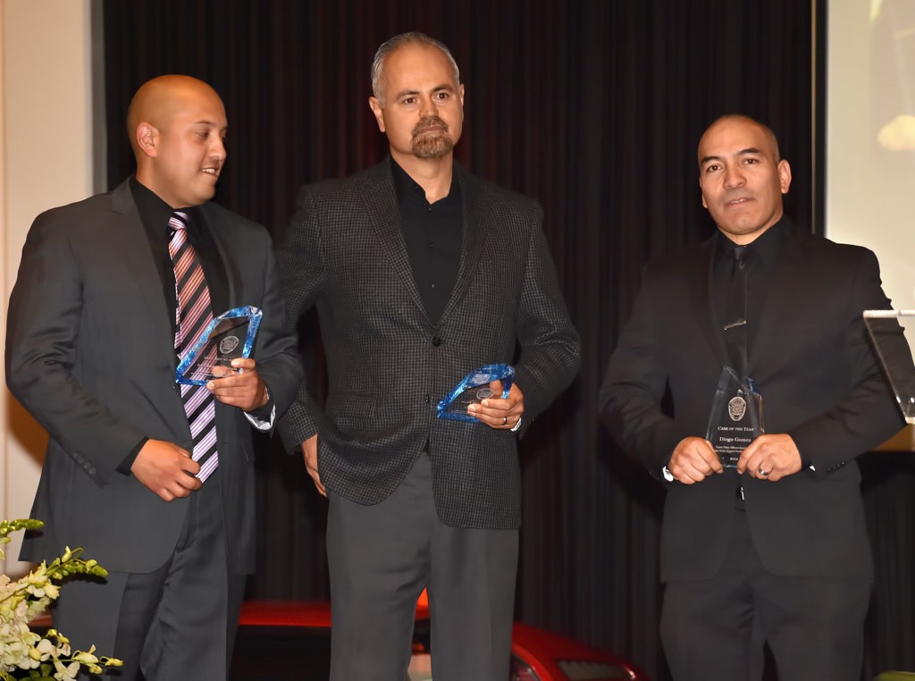 Ronnie Sandoval, left, Art Lopez and Diego Gomez receive the 2016 Case of the Year award during the Tustin PD awards banquet. Brian Poling who also received the award was not present. Photo by Steven Georges/Behind the Badge OC