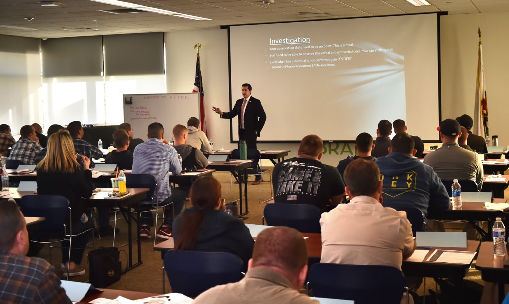 Orange County Deputy District Attorney Brian Orué talks to a room full of law enforcement officers during an ARIDE (Advanced Roadside Impaired Driving Enforcement) training class at the Fullerton Library. Photo by Steven Georges/Behind the Badge OC