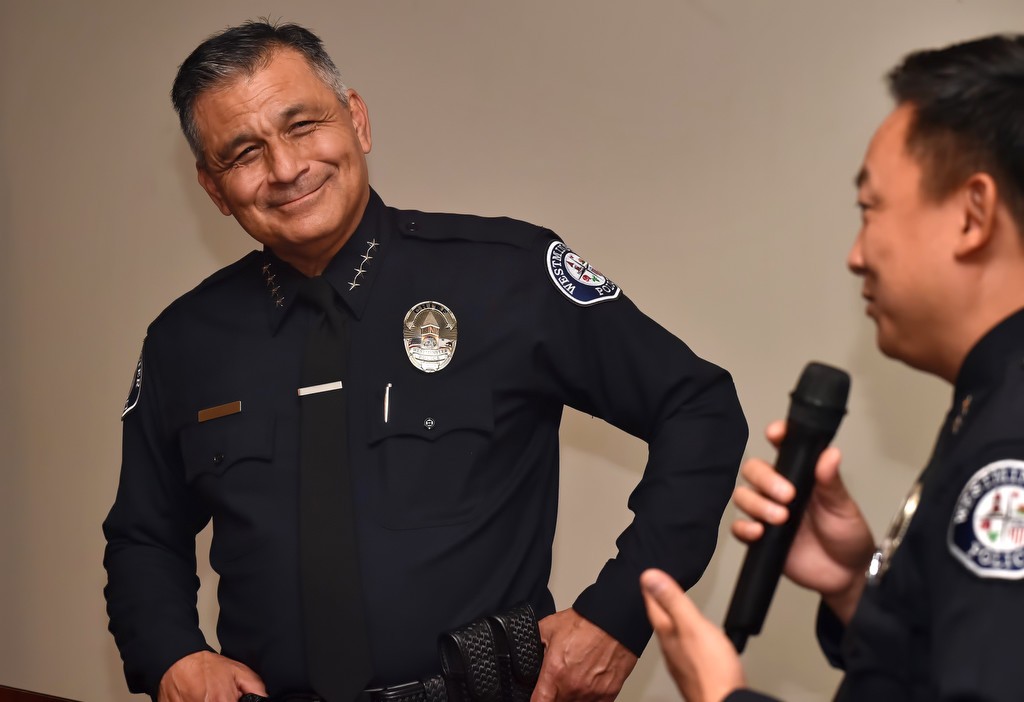 WPD Deputy Chief Timothy Vu, right, thanks Police Chief Roy Campos for his service during the police chief transitional period. Photo by Steven Georges/Behind the Badge OC