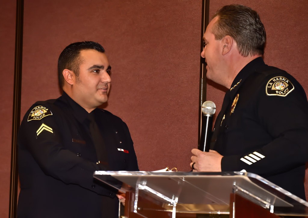 Shawn Miller of LHPD is congratulated by La Habra Police Chief Jerry Price for his promotion to Corral. Photo by Steven Georges/Behind the Badge OC