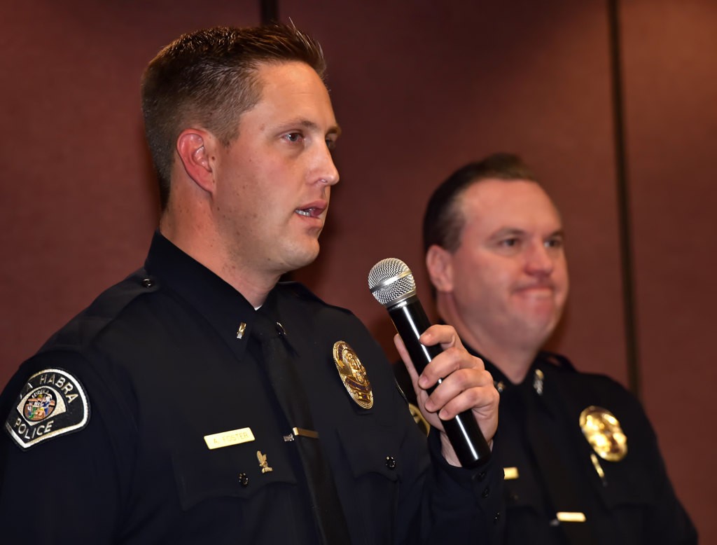 Lt. Adam Foster says a few words, with La Habra Police Chief Jerry Price behind him, after receiving his new lieutenants badge, during LHPD’s promotion ceremony.  Photo by Steven Georges/Behind the Badge OC