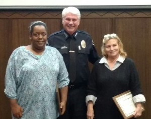 Rita Moon, left, and her mother Susie Moon, posed for a photo with Interim Police Chief Dave Hinig after Hinig recognized the women for turning in $3,900 in cash that they found.