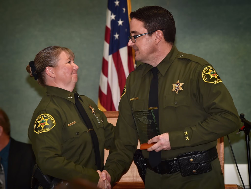 OCSD Deputy Thomas Srtammer (South East Operations), right, receives the Meritorious Service Award from Capt. Sheryl Dubsky. Photo by Steven Georges/Behind the Badge OC