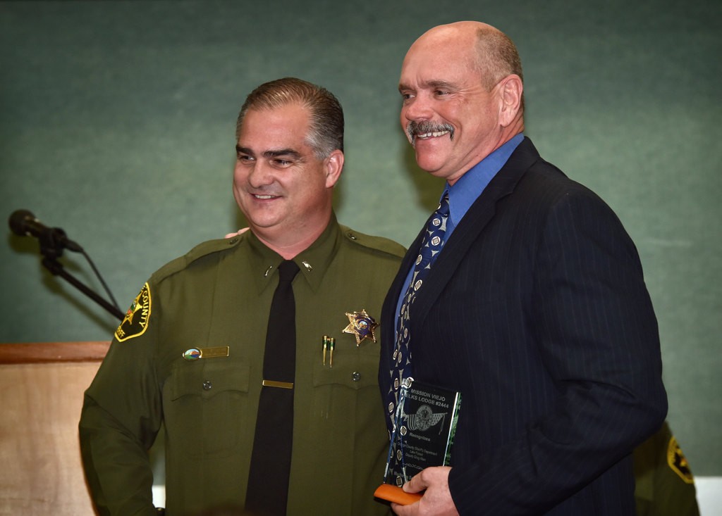 OCSD Greg Allen (Lake Forest), right, receives the Meritorious Service Award from Lt. Brad Valentine. Photo by Steven Georges/Behind the Badge OC