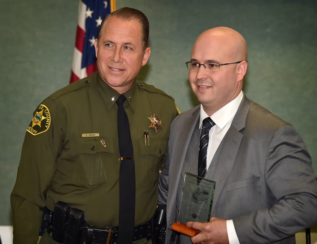 OCSD Deputy Jesse Demarest (San Clemente), right, receives the Meritorious Service Award from Lt. Dave Moody. Photo by Steven Georges/Behind the Badge OC