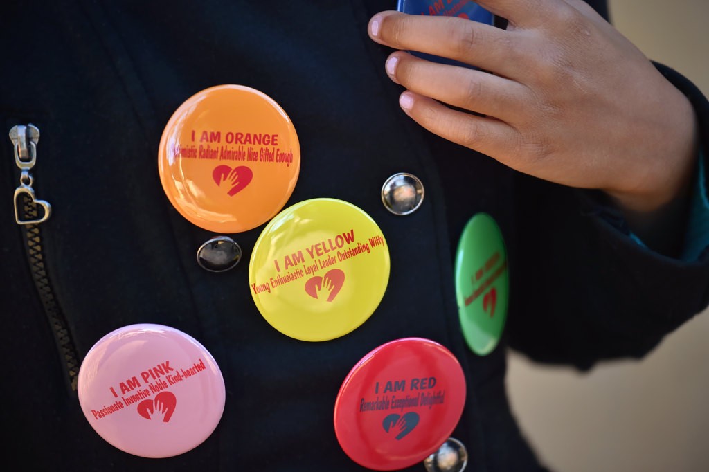 Alyssa Castille of Garden Grove with a few of the "I am" buttons created by her. Photo by Steven Georges/Behind the Badge OC