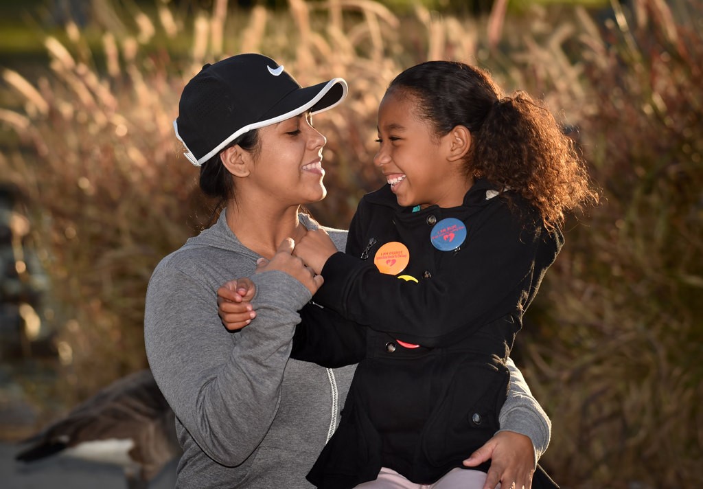 Alyssa Castille, 9, with her mother Loraine Castille. Photo by Steven Georges/Behind the Badge OC