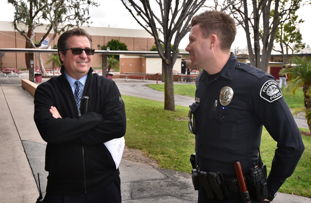William Mynster, principal of Troy High, talks to Fullerton PD SRO Andrew Coyle while on campus. Photo by Steven Georges/Behind the Badge OC