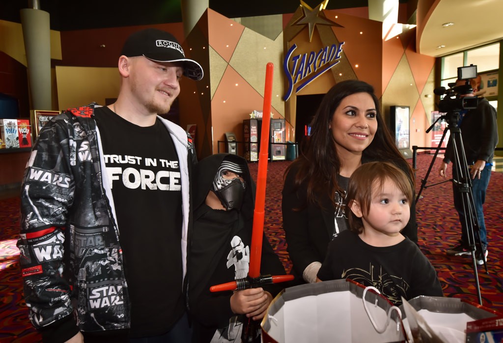 OPD PD Officer Sharif Muzayen, his wife Vanessa Muzayen, and their kids, Leia and Luke, arrive at Century Stadium 25 and XD theaters in Orange for a special showing of the new Star Wars movie, Rogue One. Photo by Steven Georges/Behind the Badge OC