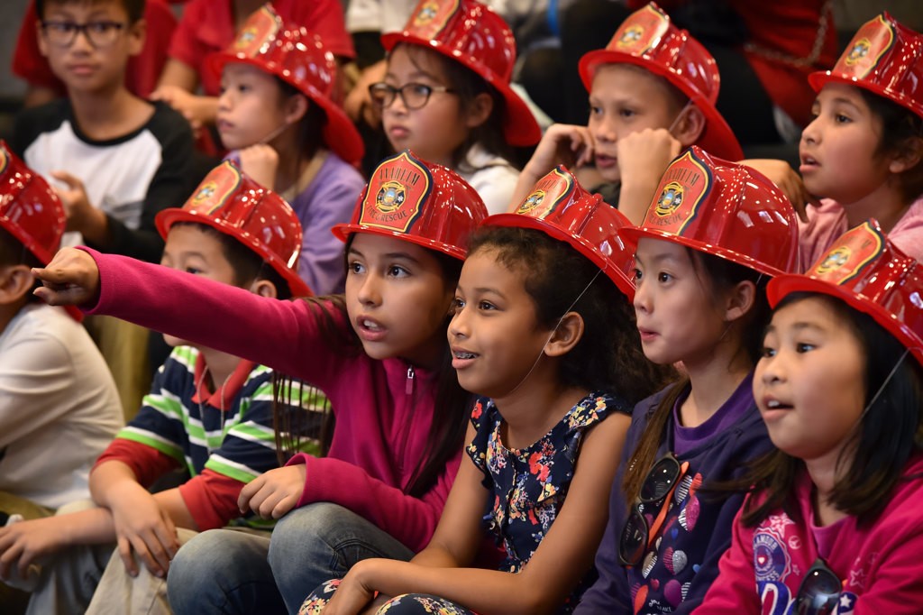 Kids from Schweitzer Elementary and Disney Elementary Schools in Anaheim attend a Wear Your Helmet Like A Pro talk given by AF&R to encourage kids to where a bicycle helmet whenever they ride. Photo by Steven Georges/Behind the Badge OC