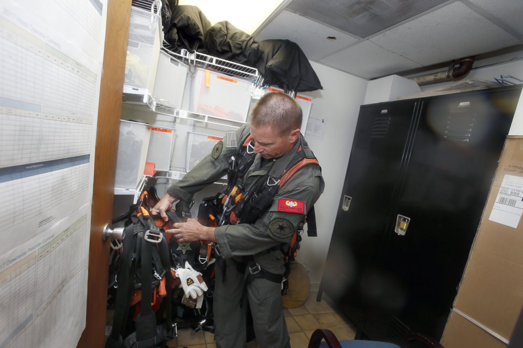 Jim Slikker in the Orange County Sheriff's Department's search and rescue crew equipment room. Photo by Christine Cotter